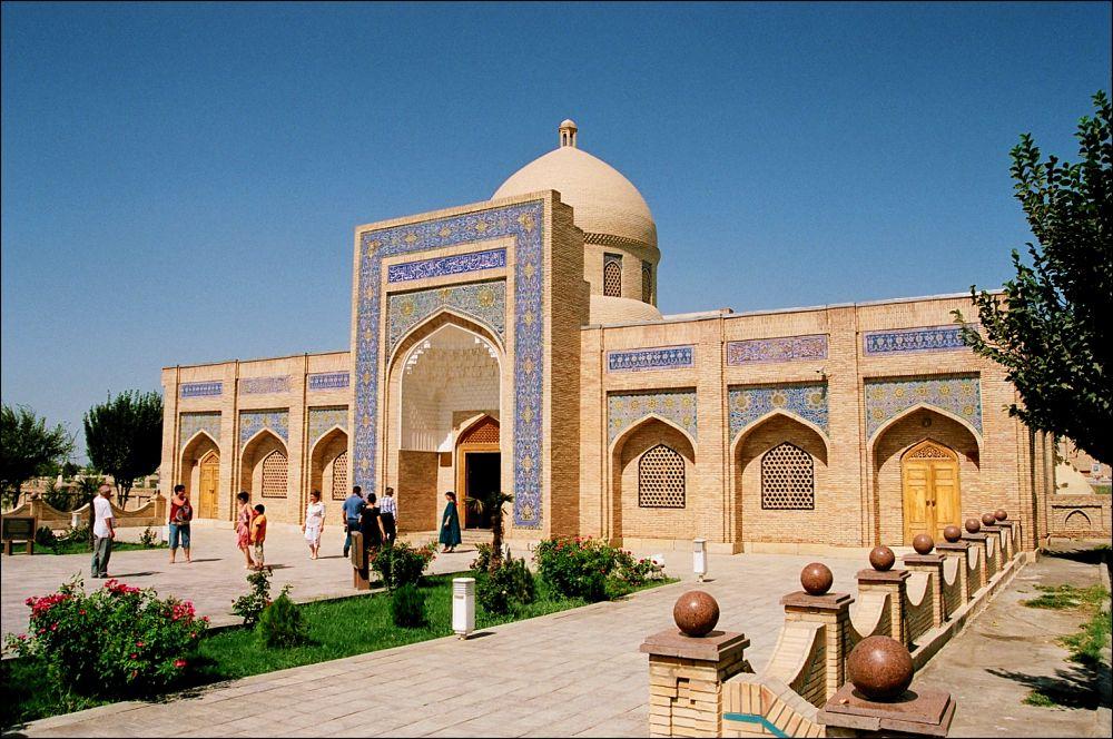 The serene stone courtyard and sacred mulberry tree at Bahauddin Naqshband sanctuary