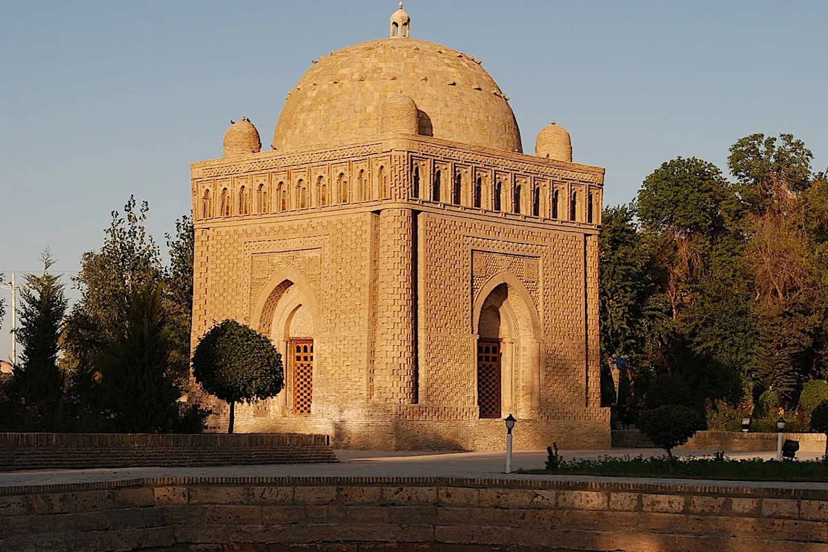 Intricate woven brickwork of the cubic Samanid Mausoleum in morning light
