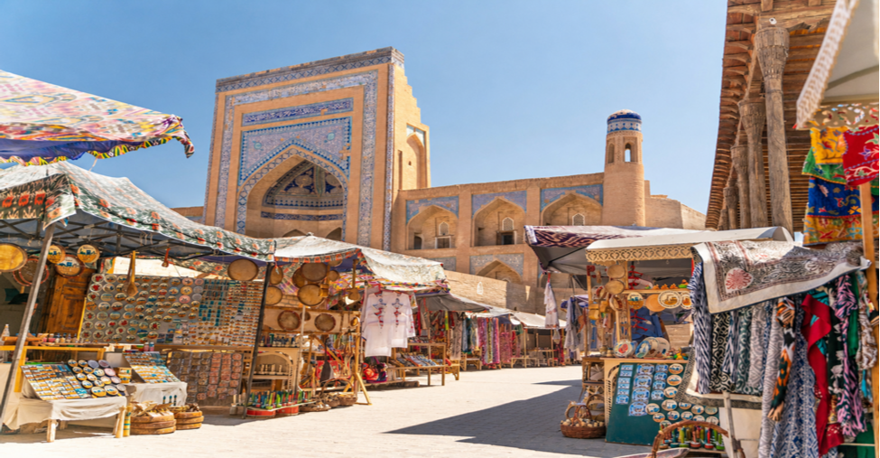 High arched entrance and vaulted corridors of Allakuli Khan Caravanserai in Khiva