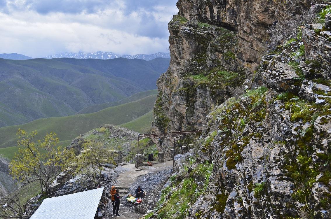 Winding stairs climbing the dramatic rocky ridge toward Hazrat Daud Cave
